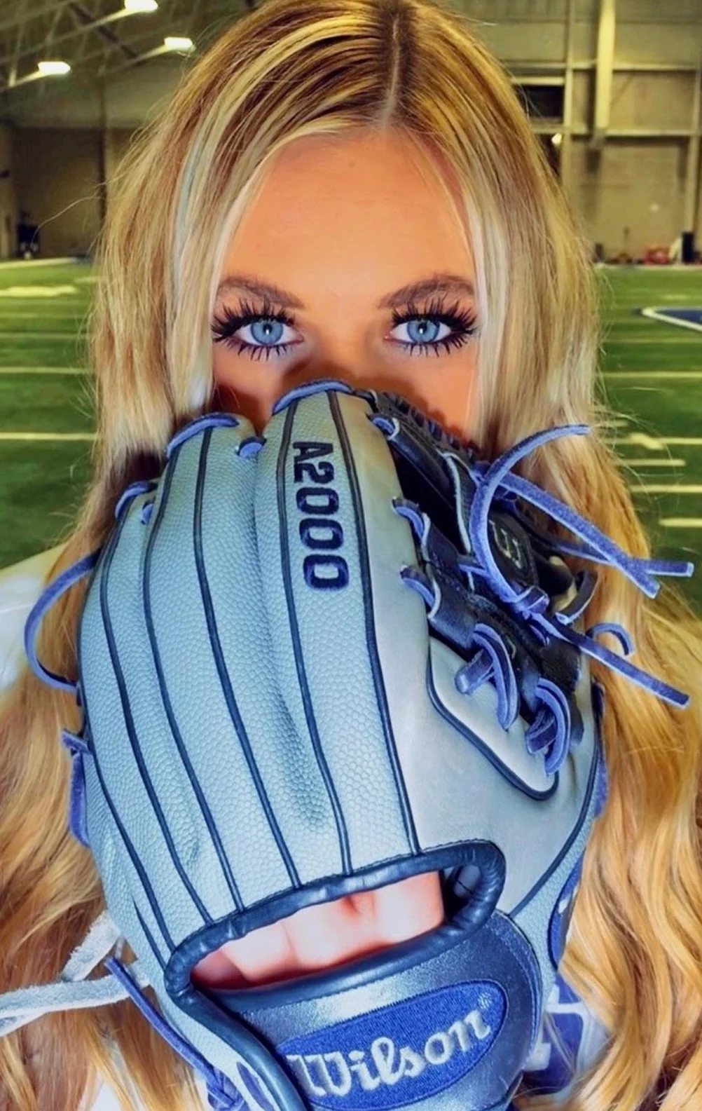 Portrait with a blue softball glove